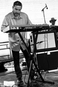 Robert Anwood playing keys at Beaconfest 2022